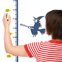 Height chart wall sticker of rupunzel in a tower being rescued py a prince with a mother charting the height of their child.