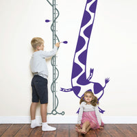 Height chart wall sticker of a giraffe singing into a microphone with a young boy and girl nearby.