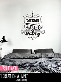 Wall quote sticker with text "I Dream For A Living" in a bedroom above a bed.