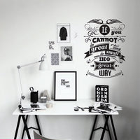 Wall quote sticker with text "You Cannot Do Great Things Do Small Things In A Great Way" near a table or desk with various nick nacks nearby.