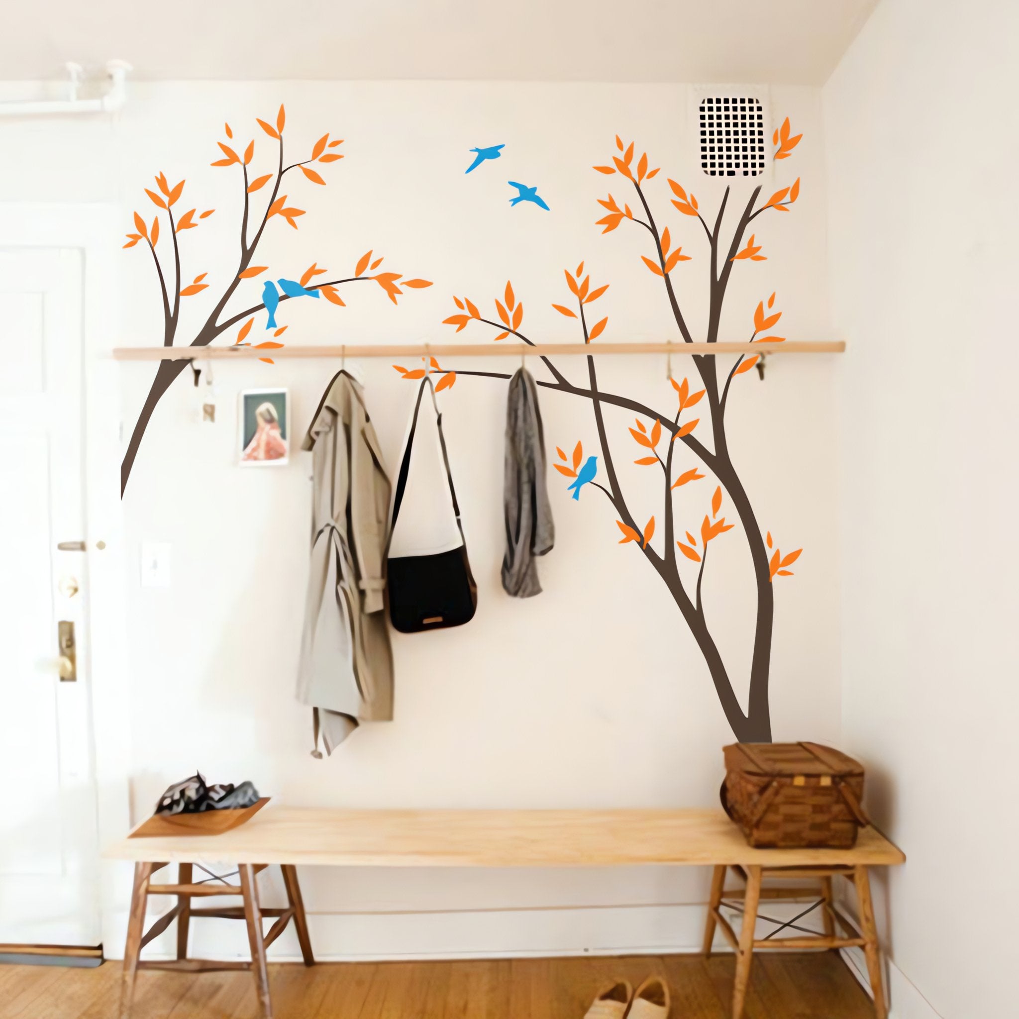 Tree wall sticker with birds and leafy branches in a cloak room.