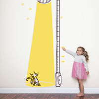 Height chart wall sticker of a cat bathed in light from a street lamp with a young girl nearby.