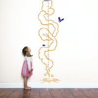 Height chart wall sticker of a monkey with a jetpack with a young girl nearby.