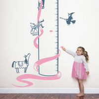 Height chart wall sticker of rupunzel in a tower being rescued py a prince with a young girl nearby.