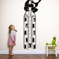 Height chart wall sticker of King Kong atop a sky scraper with a young girl and kermit the frog nearby.