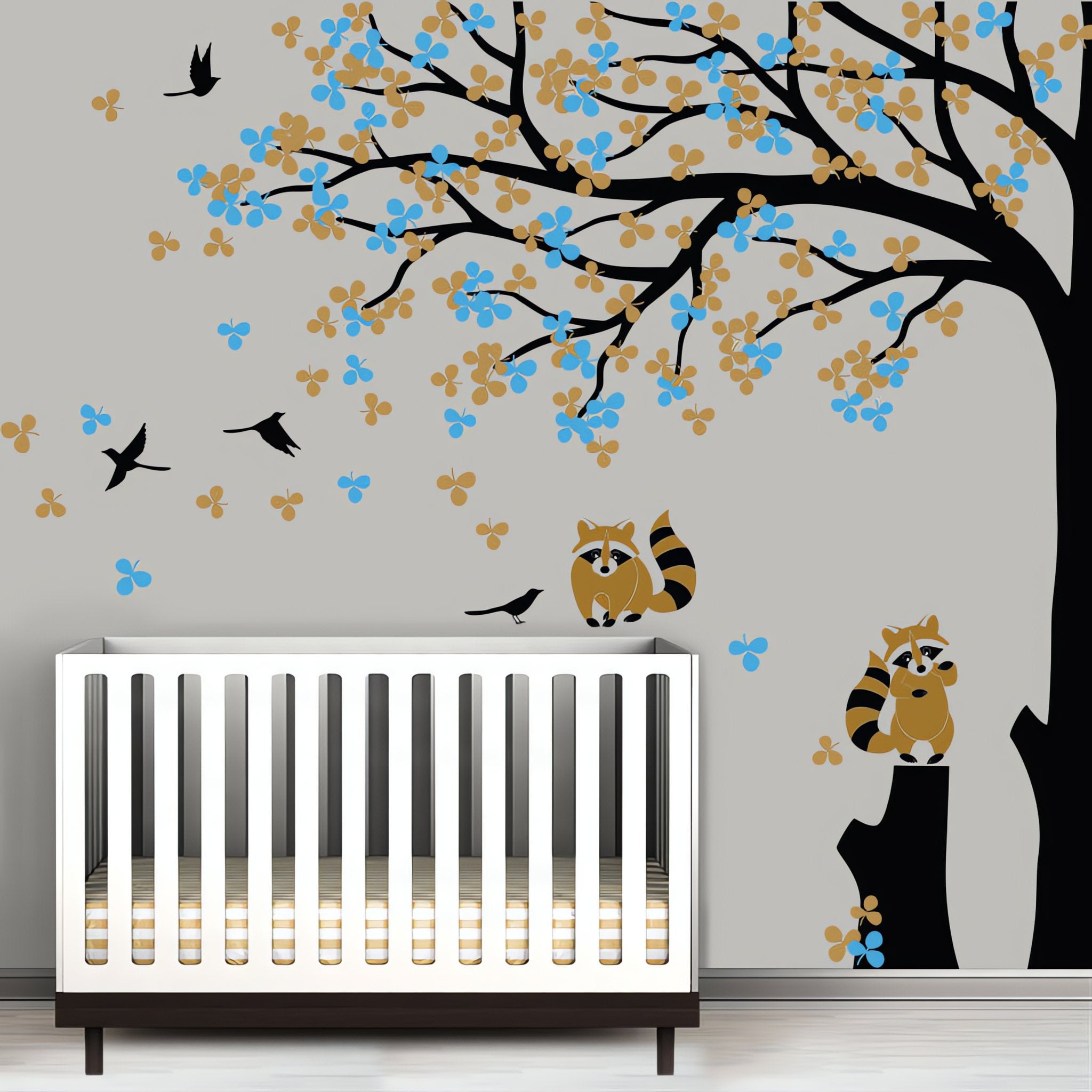 Tree wall sticker with leaves blowing and birds in a nursery with a crib.
