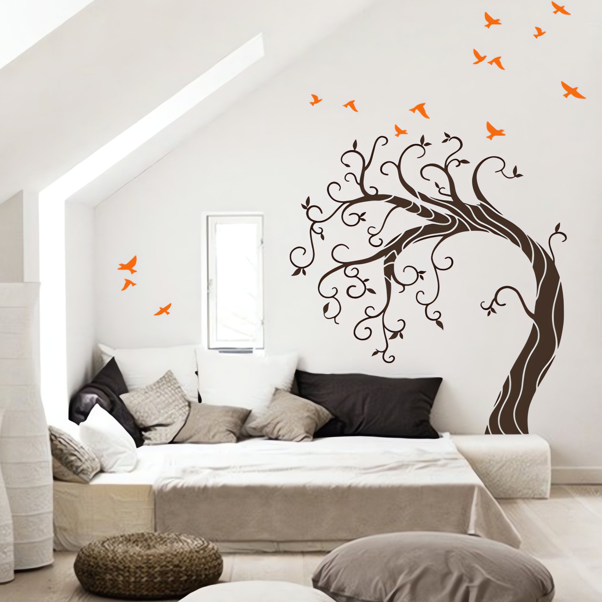 Tree wall sticker with birds in a bedroom or living room with seating.