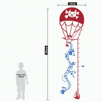 Height chart wall sticker of a hot air balloon taking off, a young girl nearby dimensions.