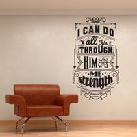 Wall quote sticker with text "I Can Do All This Through Him Who Gives Me Strength" in a living space with a modern looking chair.