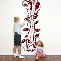 Height chart wall sticker of jack and the giant beanstalk with a young boy and girl nearby.