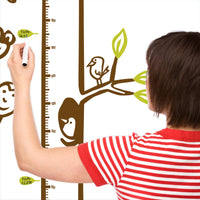 Height chart wall sticker with monkeys hanging from a tree to form a chain with a mother charting the height of their child.