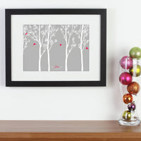 Personalized framed print with trees and family of birds with names next to balls.