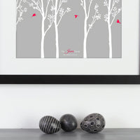 Personalized framed print with trees and family of birds with names next to ornamental eggs.