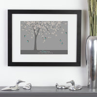 Personalized framed print of a tree with a family of butterfly with names next to vase.