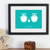 Personalized framed print of a family of owls with names next to a bookend and a large dice.