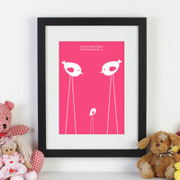 Personalized framed print of 2 birds and a baby bird, with a date and names next to cuddly toys.