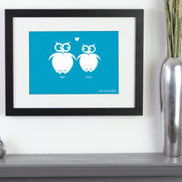 Personalized framed print of 2 owls in love with a significant date next to a vase.
