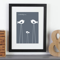 Personalised framed print with birds next to bookends.