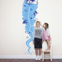 Height chart sticker of a tornado with a young boy and girl nearby.