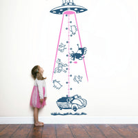 Height chart wall sticker of a UFO abducting a car with a young girl nearby.