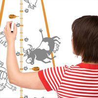 Height chart wall sticker of a UFO abducting a car with a mother charting the height of their child.