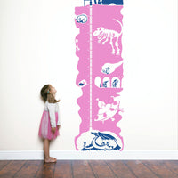 Height chart wall sticker of an underground mineshaft with a young girl nearby.