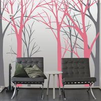 Tree wall sticker with no leaves in a room with 2 modern chairs.